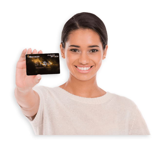Woman holding a Brothers Leagues Club membership card and smiling at the camera
