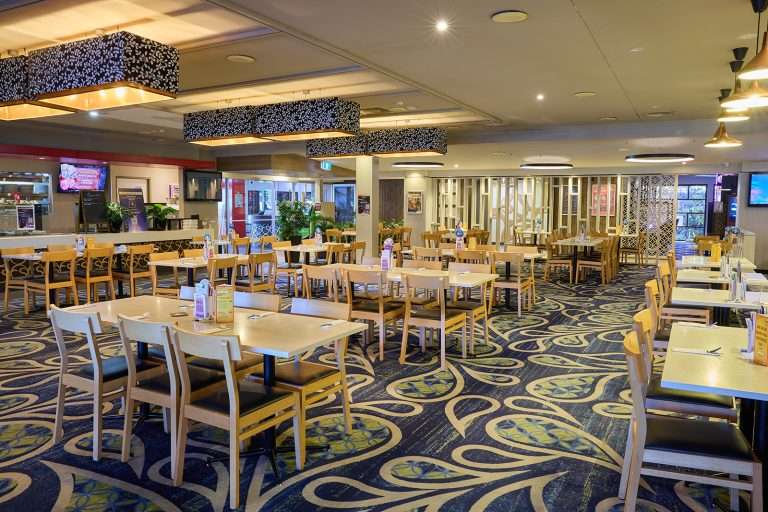 Fuller Sports Club main bar gaming area with poker machines and sports betting terminals in Cairns